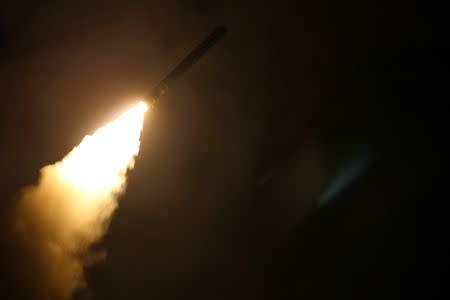 The U.S. Navy guided-missile cruiser USS Monterey fires a Tomahawk land attack missile April 14, 2018. U.S. Navy/Lt. j.g Matthew Daniels/Handout via REUTERS.