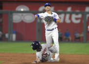 Kansas City Royals' second baseman Whit Merrifield throws to first after forcing out Houston Astros' Jake Meyers, getting Martin Maldonado out for a double play during the fifth inning of a baseball game Tuesday, Aug. 17, 2021, in Kansas City, Mo. (AP Photo/Reed Hoffmann)