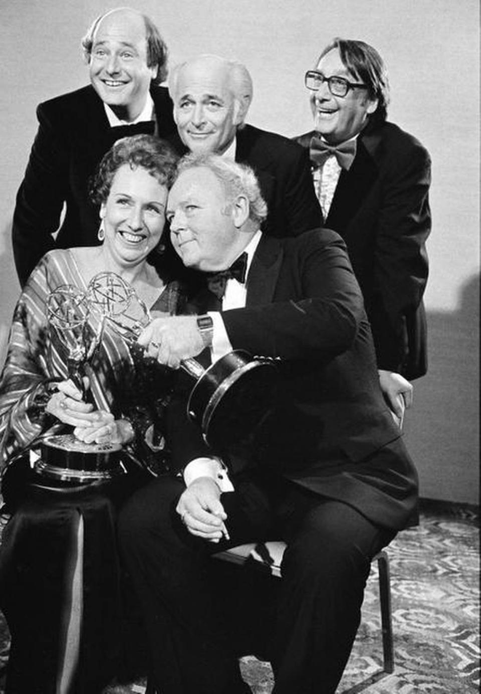 In this Sept. 18, 1978, file photo, actors Jean Stapleton, seated left, and Carroll O’Connor, seated right, hold their Emmys as they pose with Rob Reiner, standing from left, who won an Emmy for supporting actor in the same series, show producer Norman Lear and executive producer Mort Lachman. In October 2014, Lear released a new memoir, ‘Even This I Get To Experience.’