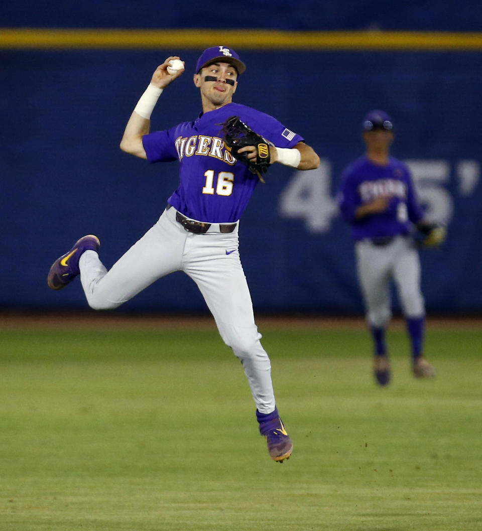 LSU shortstop Brandt Broussard throws to first but not in time for to get Mississippi State's Jake Mangum out during the first inning of a Southeastern Conference tournament NCAA college baseball game Wednesday, May 22, 2019, in Hoover, Ala. (AP Photo/Butch Dill)