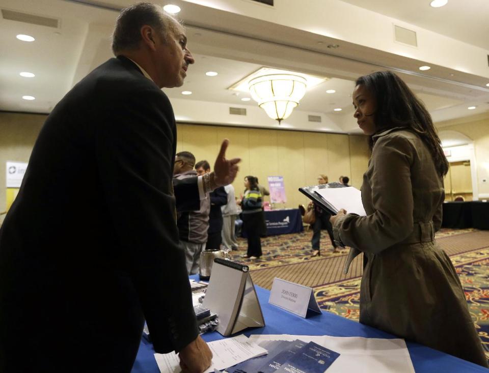 In this Thursday, Oct. 25, 2012 photo, John Ferri of Combined Insurance talks to Samantha Ellis, of Ellenville, N.Y., during a job fair at the Marriott Hotel, in Colonie, N.Y. According to government reports released Friday, Nov. 2, 2012, the U.S. economy added 171,000 jobs in October, and the unemployment rate ticked up to 7.9 percent. (AP Photo/Mike Groll)