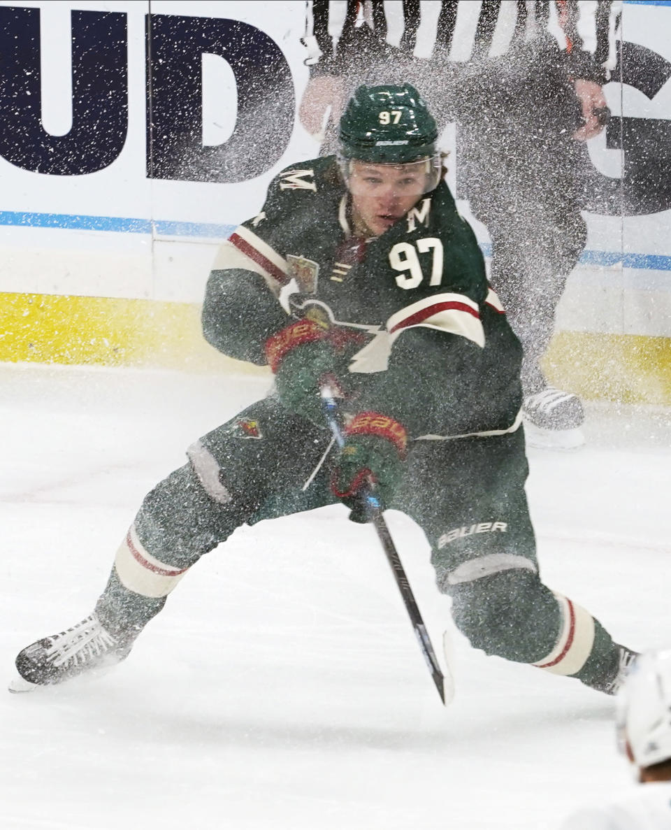 Minnesota Wild's Kirill Kaprizov shaves off the ice during the first period of the team's NHL hockey game against the San Jose Sharks, Friday, Jan. 22, 2021, in St. Paul, Minn. (AP Photo/Jim Mone)