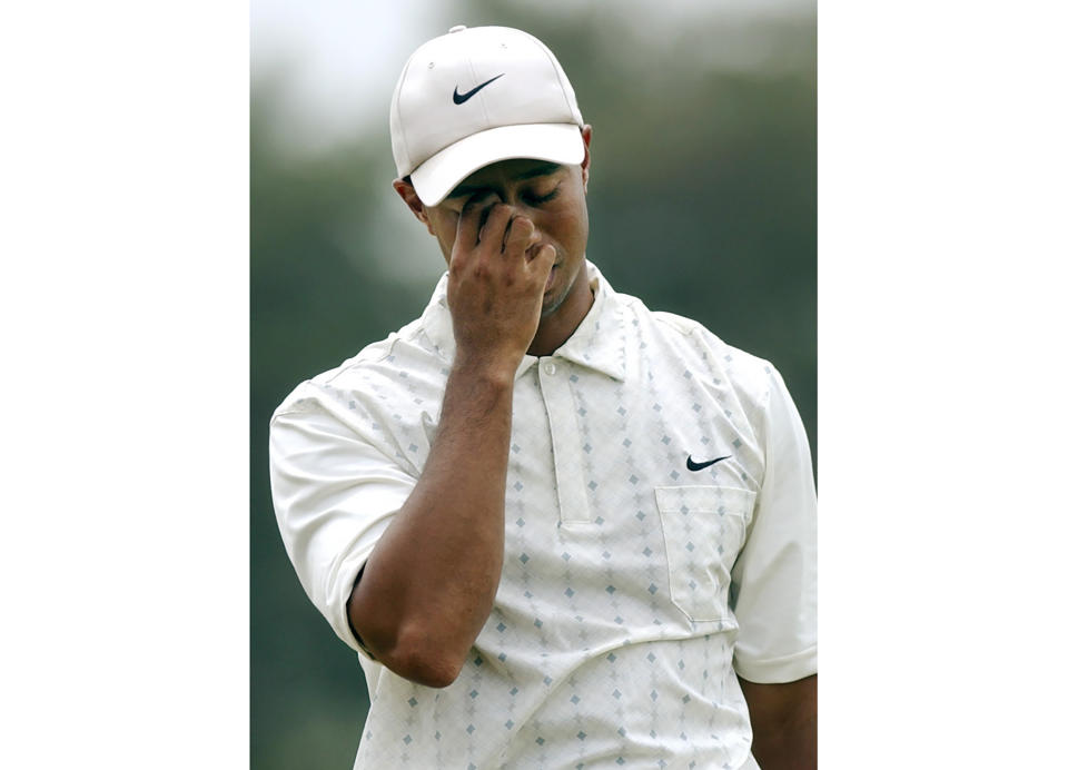FILE - In this June 19, 2004, file photo, Tiger Woods reacts on the fifth fairway after his shot toward the green during the third round of the U.S. at Shinnecock Hills Golf Club in Southampton, N.Y. Tiger Woods and Nike indicated Monday, Jan. 8, 2024 they have parted ways after more than 27 years. Woods in a social media post thanked Nike co-founder Phil Knight for his “passion and vision” that brought Nike and the Nike Golf partnership with Woods together. “Over 27 years ago, (AP Photo/Charles Krupa, File)