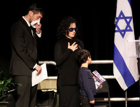 Jonathan Sherman (L), son of Apotex pharmaceutical billionaire Barry Sherman and his wife Honey, makes his way on stage to speak during their memorial, days after what police called their suspicious deaths in Toronto, Ontario, Canada, December 21, 2017. REUTERS/Mark Blinch