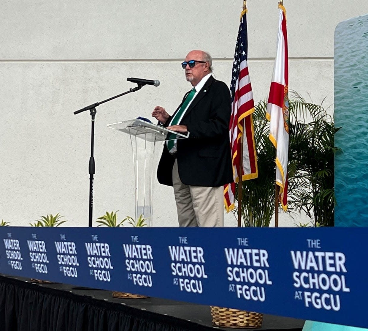 Florida Gulf Coast University president Mike Martin speaks to about 200 people gathered at the Water School for a ribbon cutting ceremony.