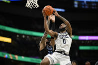 Georgetown guard Dontrez Styles (0) goes to the basket against Marquette forward David Joplin (23) during the second half of an NCAA college basketball game, Saturday, Feb. 3, 2024, in Washington. (AP Photo/Nick Wass)