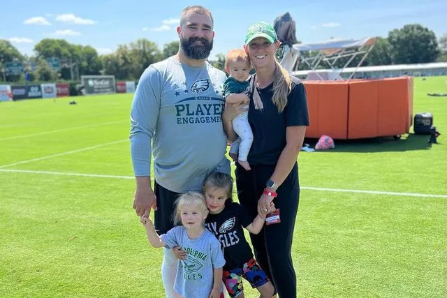 <p>Kylie Kelce/Instagram</p> Jason and Kylie Kelce on the field with daughters Elliotte, Wyatt and Bennett