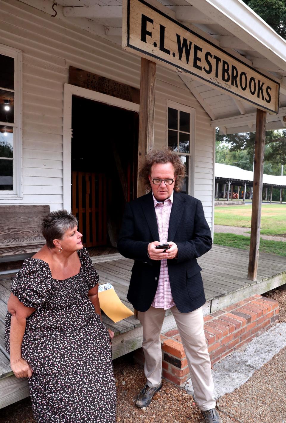 Jason Rose, the majority partner of a purposed minor league baseball team that could come to Murfreesboro, signs a petition to save Cannonsburgh Village on the steps of the FL Westbrooks country store at the village on ,Tuesday, Sept. 12, 2023, with the help of Barbara Hudson Fry.