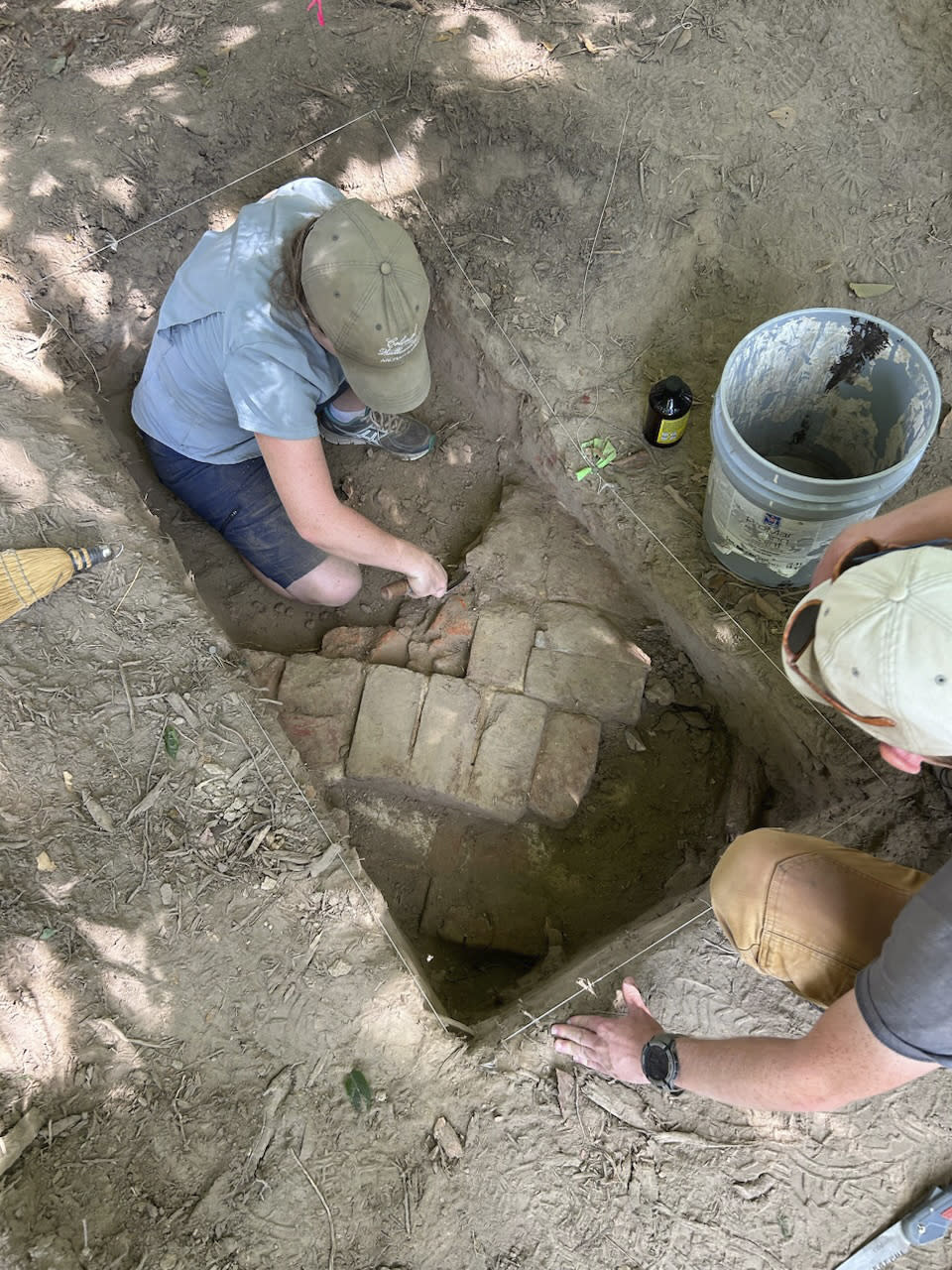 Archaeologists at Colonial Williamsburg in Virginia work around a chimney base in the summer of 2023 at a site where military barracks are believed to have stood during the American Revolution. The museum announced the site’s discovery on Tuesday, May 14, 2024. (Colonial Williamsburg Foundation via AP)