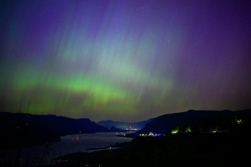 The northern lights are seen above the Columbia River Gorge from Chanticleer Point Lookout in the early morning hours of May 11, 2024, in Latourell, Oregon. / Credit: Getty Images