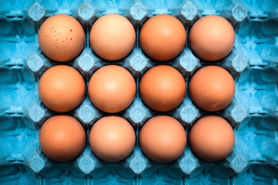 Fresh organic eggs in cardboard tray