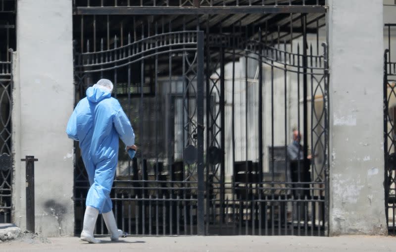 A member of medical team wearing protective equipment enters the Institute of Research for Tropical Medicine amid concerns about the spread of the coronavirus disease (COVID-19), in Cairo