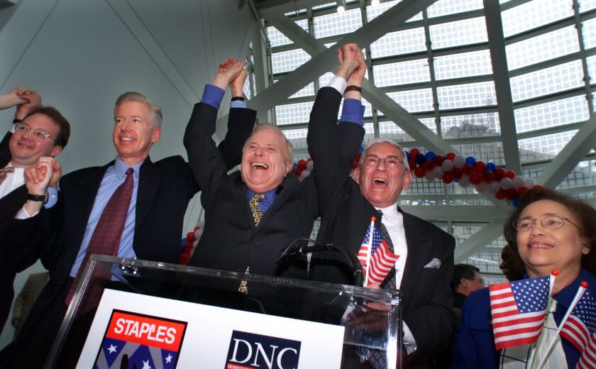 ME.DNC.1.0315.PM––California govenor Gray Davis, left, Los Angeles Mayor Richard Riordan, center, and developer Eli Broad hold there hands high after a press conference announcing the year 2000 Democratic National Convention will be held at the Staples Center. The announcemnet took place at the Los Angeles convention center.