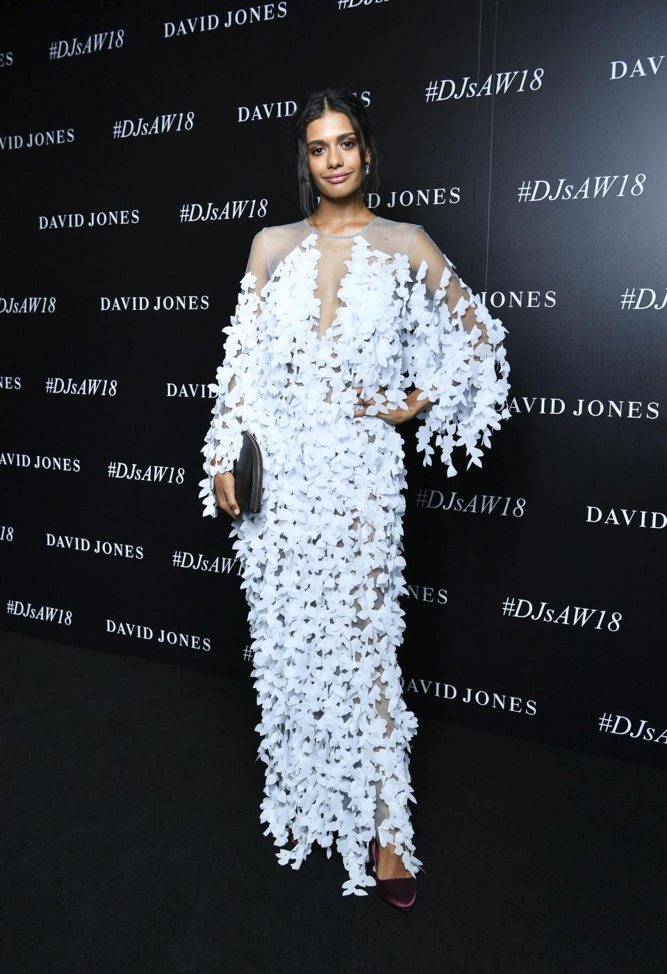 <p>Australian actress Madeleine wore a white statement dress covered in textured flowers.</p>