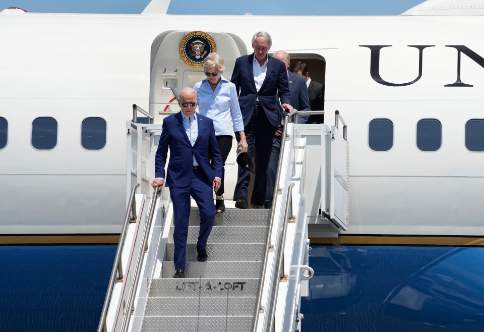 President Joe Biden arrives at Rhode Island T.F. Green International Airport with Senators Elizabeth Warren and Ed Markey on July 20, 2022.