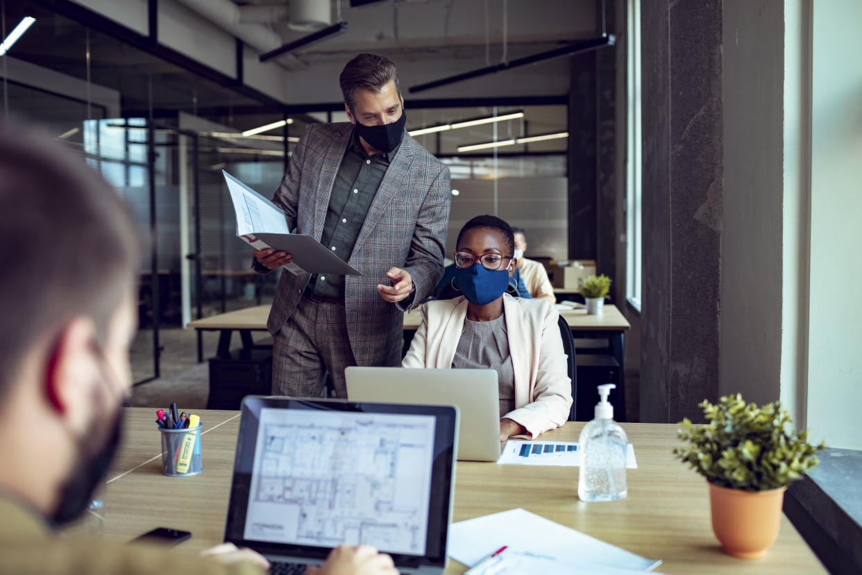 Close up of a group of business people working in an office