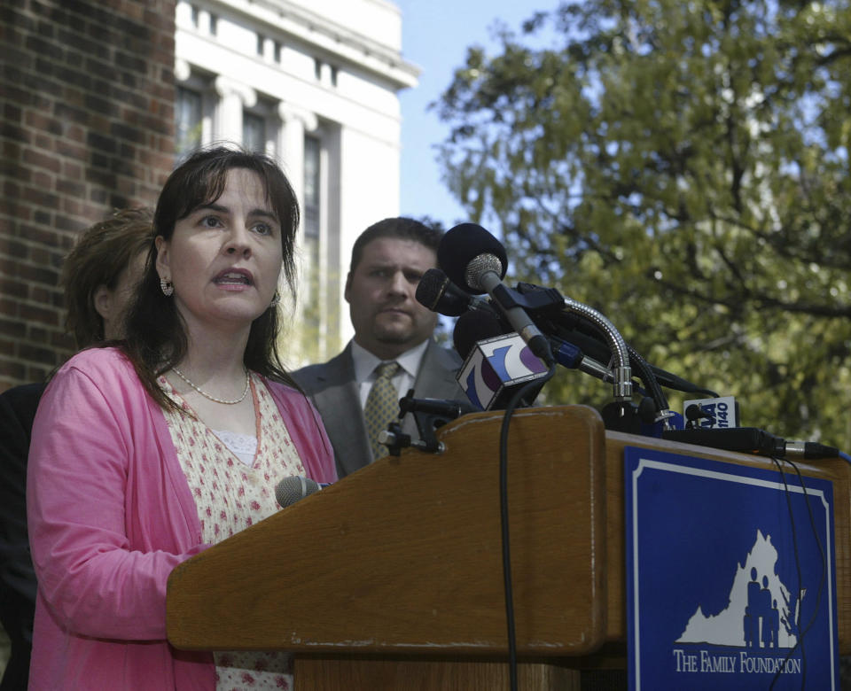 FILE - Lisa Miller answers questions about her custody battle during a news conference at the State Capitol on Thursday, April 17, 2008, in Richmond, Va. Federal court records say that Miller was taken into federal custody Jan. 27, 2021. She is awaiting transfer to Buffalo, New York, where she was indicted in 2014 on international parental kidnapping charges. Miller allegedly fled the United States for Nicaragua in 2009 rather than share custody of her child with her former same-sex partner. (AP Photo/Lisa Billings, file)