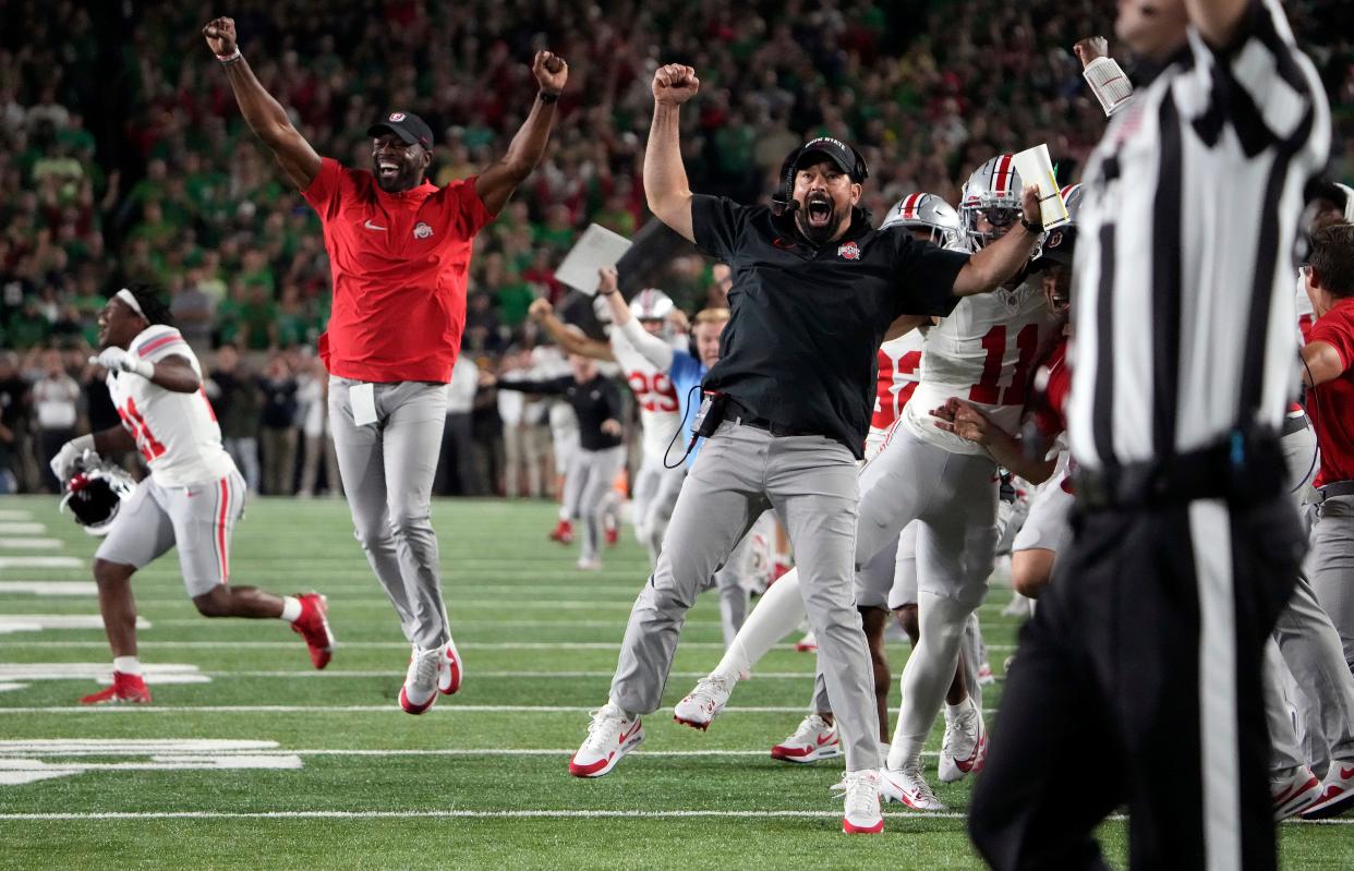 Ohio State coach Ryan Day celebrates Chip Trayanum's game-winning touchdown against Notre Dame.