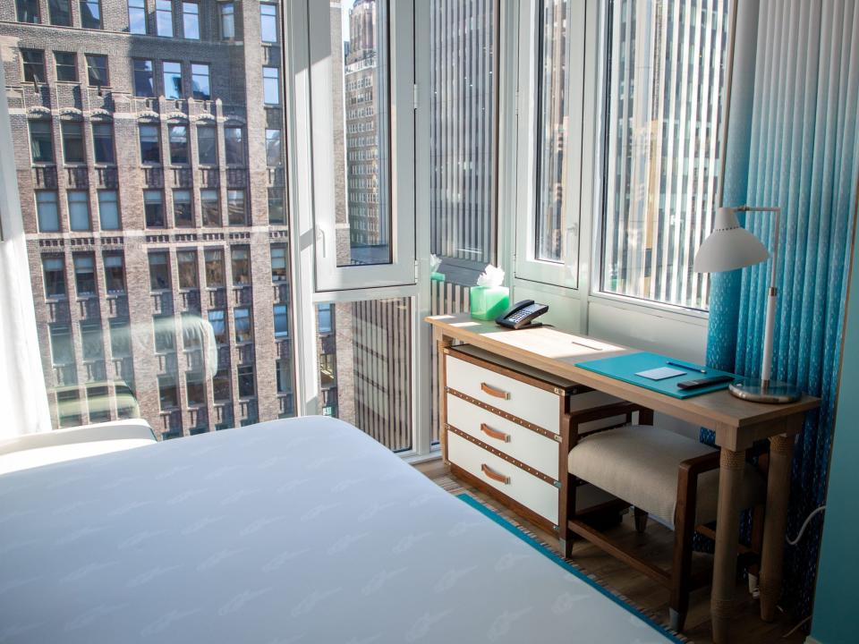 a desk overlooking a view of the city