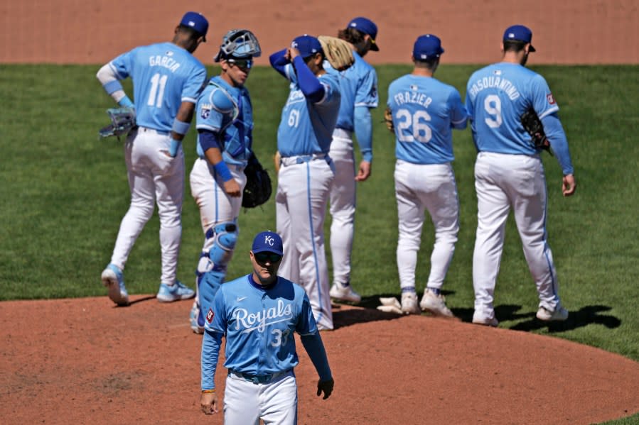 Kansas City Royals manager Matt Quatraro walks back to the mound after making a pitching change during the sixth inning of a baseball game against the Baltimore Orioles Sunday, April 21, 2024, in Kansas City, Mo. (AP Photo/Charlie Riedel)