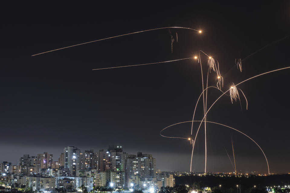 FILE - Israel's Iron Dome missile defense system fires interceptors at rockets launched from the Gaza Strip, in Ashkelon, southern Israel. Thursday, May 11, 2023. Since Russia invaded Ukraine in February 2022, more than 45,000 Ukrainians have sought refuge in Israel. Then, Israel's war erupted. Now many are reliving their trauma. Some have left Israel, but many remain — refusing to again flee a war. (AP Photo/Tsafrir Abayov, File)