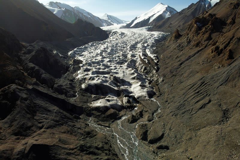 FILE PHOTO: Meltwater from the Laohugou No. 12 glacier, flows though the Qilian mountains