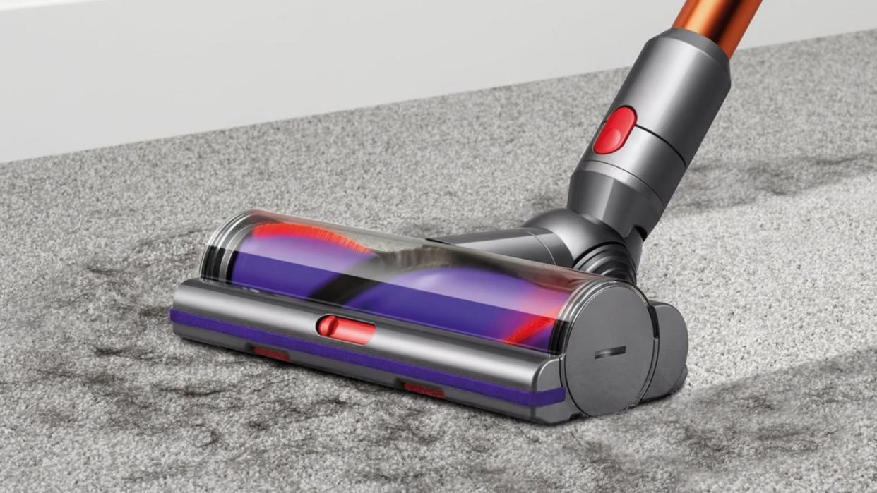  The Dyson Cyclone V10 Absolute cleaning hair on a rug 