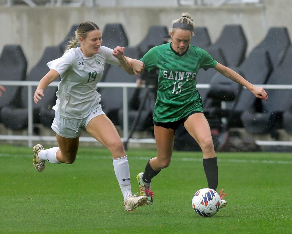 Strongsville's Macy Felton (No. 19) defends against Seton's Lexi O'Shea (No. 15) during the state Division I OHSAA Championship at Lower.com field on Nov. 11, 2022, in Columbus, Ohio. The Saints defeated Strongsville 1-0 on a rainy, chilly pitch.