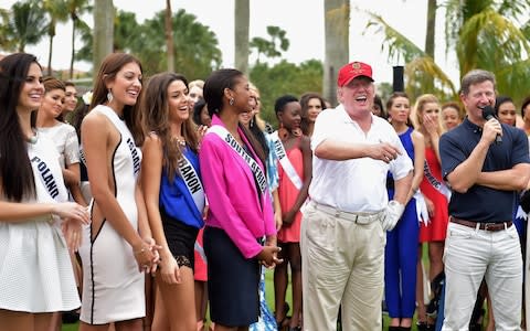 Trump opening a golf course at Trump National Doral Miami in 2015 - Credit: &nbsp;Gustavo Caballero/Getty