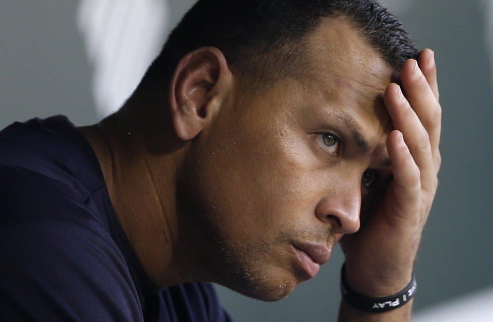 FILE - In this Sept. 11, 2013, file photo, New York Yankees&#39; Alex Rodriguez wipes sweat from his brow as he sits in the dugout before a baseball game against the Baltimore Orioles in Baltimore. The U.S. government says New York Yankees star Alex Rodriguez paid his cousin almost $1 million to keep secret Rodriguez&#39;s use of performance enhancing drugs. In court documents filed last week in Miami, federal prosecutors say Rodriguez paid $900,000 last year to settle a threatened lawsuit by Yuri Sucart, who had worked as Rodriguez&#39;s personal assistant. Sucart, in a letter from his lawyer, threatened to expose Rodriquez&#39;s PED use if he wasn&#39;t paid $5 million. (AP Photo/Patrick Semansky, File)