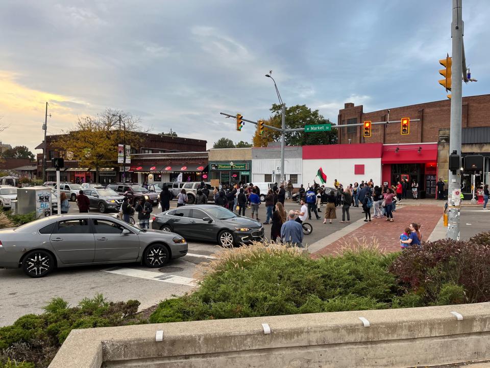 Protesters take to Highland Square in Akron on Wednesday, Oct. 12, 2022, one day after the Akron Police Department said the eight involved in Jayland Walker's shooting death have returned to work in the office.