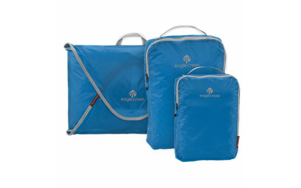 <p>The Eagle Creek Pack-It system is a great way to stay organized and optimize the space in your travel bag. The starter kit offers a garment folder for dress shirts and two cubes to roll shirts and pants in.</p> <p><strong>To buy:</strong> <a rel="nofollow noopener" href="https://www.amazon.com/dp/B01JOCOSXO/ref=twister_B00F3Z7WLW?_encoding=UTF8&psc=1" target="_blank" data-ylk="slk:amazon.com;elm:context_link;itc:0;sec:content-canvas" class="link ">amazon.com</a>; $59</p>