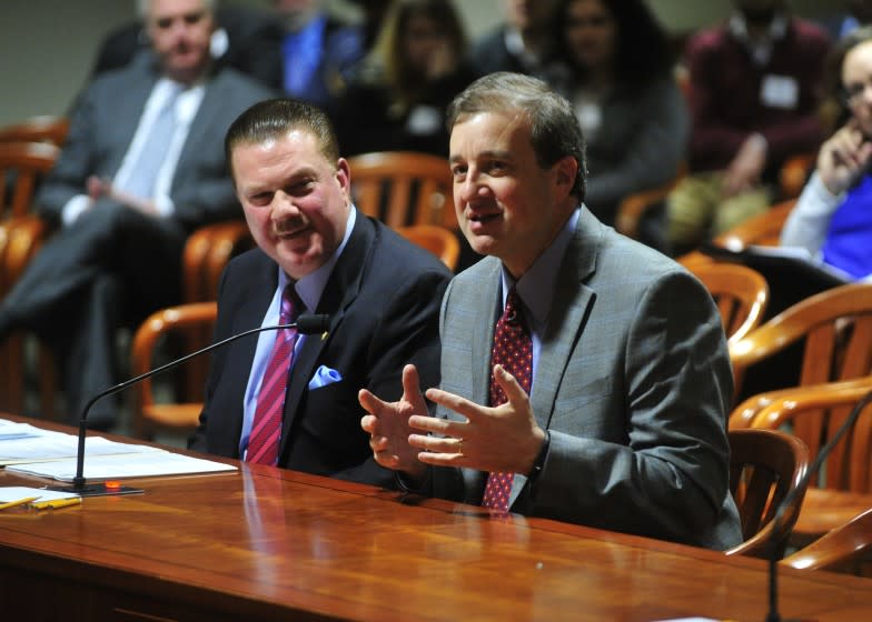 Scott Yates, right, testifies before the Michigan State Legislat