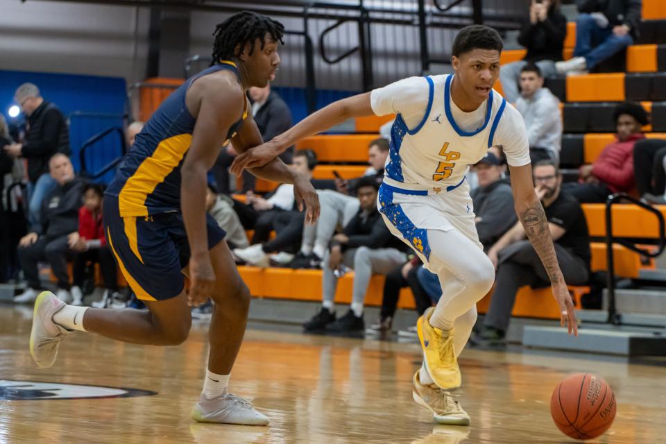 Meleek Thomas (5) Drives to the hoop while being guarded by Omarion Ralands (10) in the Leopards 2024 Burger King Classic semifinal matchup against Niagara Falls.