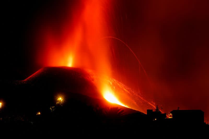 Lava and smoke rise following the eruption of a volcano on the Canary Island of La Palma