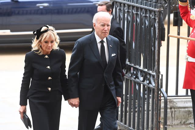 <p>Geoff Pugh - WPA Pool/Getty</p> President Joe Biden and first lady Dr. Jill Biden attend Queen Elizabeth's state funeral in September 2022.