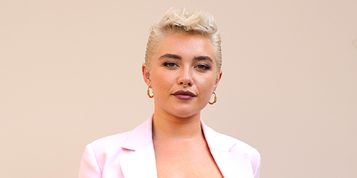 Florence Pugh is a punk Barbie in a pastel pink suit and bow bra