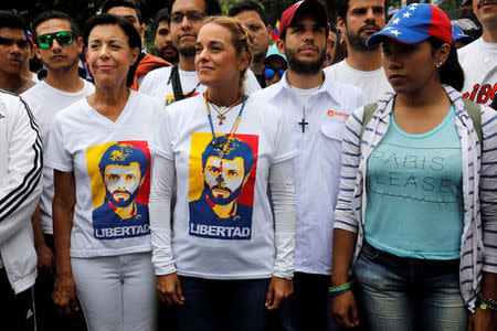 Lilian Tintori (C), wife of jailed opposition leader Leopoldo Lopez, takes part in a rally to honour victims of violence during a protest against Venezuela's President Nicolas Maduro's government in Caracas, Venezuela, April 22, 2017. REUTERS/Carlos Garcia Rawlins