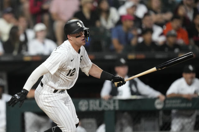 Chicago White Sox' Gavin Sheets, foreground, and Andrew Vaughn, rear, walk  to the dugout after scoring on a double by Romy Gonzalez during the fourth  inning of a baseball game in Cleveland