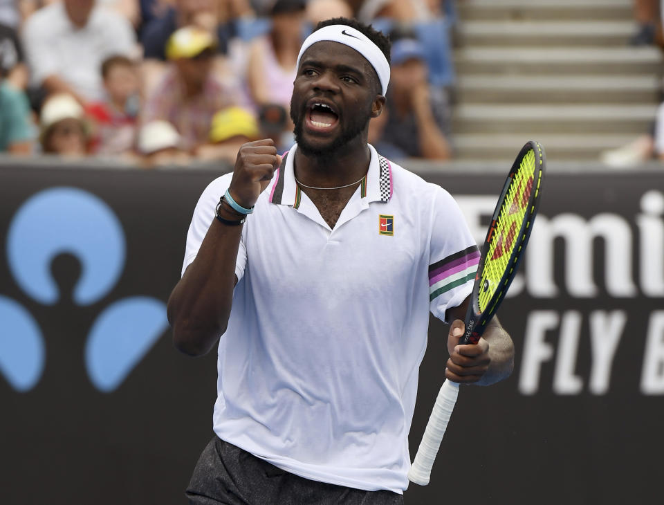 United States' Frances Tiafoe celebrates after winning the second set against Andreas Seppi of Italy in their third round match at the Australian Open tennis championships in Melbourne, Australia, Friday, Jan. 18, 2019. (AP Photo/Andy Brownbill)