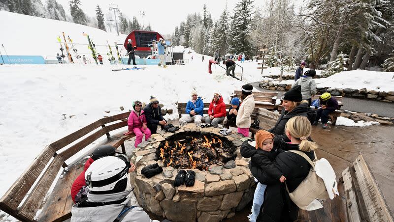 Skiers and snowboarders enjoy part of their day sitting next to a fire at Sundance Mountain Resort in Provo Canyon on Wednesday, March 13, 2024.