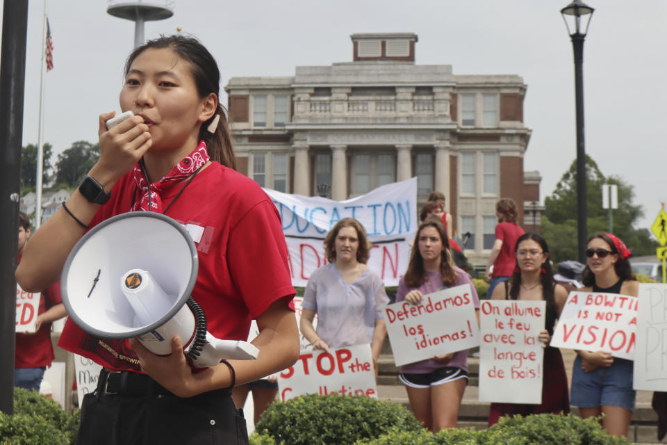 West Virginia University senior Mailyn Sadler leads a protest in the university's free speech zone outside the Mountainlair student union against cuts to programs in world languages, creative writing and more amid a $45 million budget deficit in Morgantown, W.Va., on Monday, Aug. 21, 2023. (AP Photo/Leah Willingham)