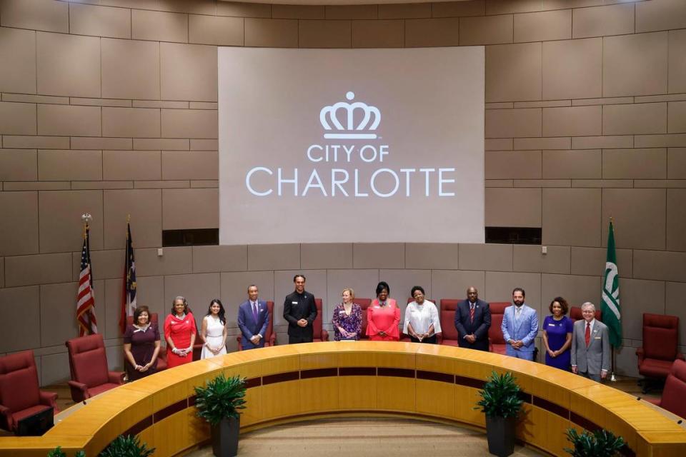 The Charlotte City Council stands after swearing in at the Charlotte-Mecklenburg Government Center in Charlotte, N.C., Tuesday, Sept. 6, 2022.