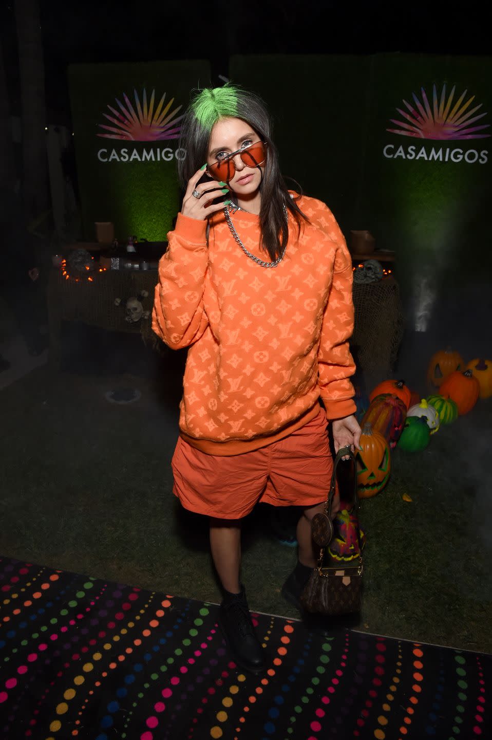 <p>Nina Dobrev stole the show as Billie Eilish at 2019's Casamigos Halloween Party, dressed in an oversized Louis Vuitton sweatshirt and long green nails to match her roots. She was dressed as the "Bad Guy" singer, but her look was very, <em>very</em> good. <br></p>