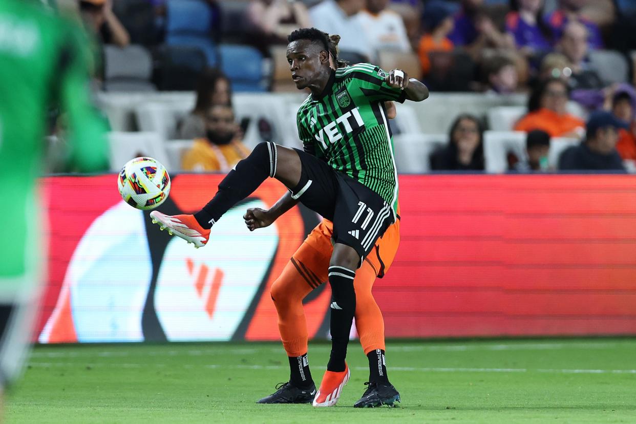 Apr 20, 2024; Houston, Texas, USA; Austin FC forward Jader Obrian (11) kicks the ball against Houston Dynamo FC during the first half at Shell Energy Stadium. Mandatory Credit: Troy Taormina-USA TODAY Sports