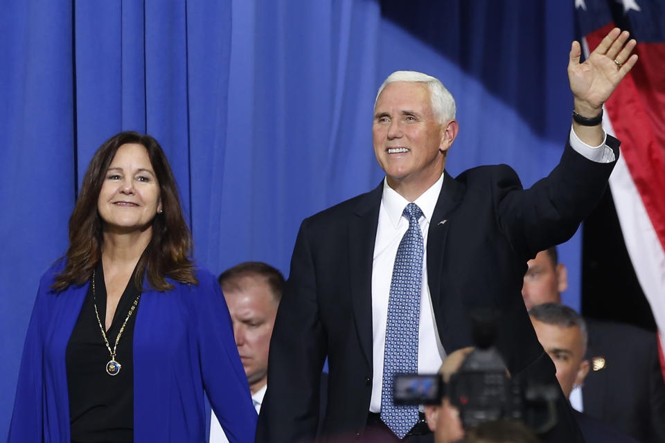 FILE - In this Oct. 10, 2019 file photo, Vice President Mike Pence and his wife Karen arrive prior to a campaign rally speech by appear in Minneapolis. Vice President Pence is bringing President Donald Trump's law-and-order campaign message to Minneapolis on Thursday, Sept. 24, 2020, showing support for law enforcement in the city where George Floyd's death after police tried to arrest him sparked angry and sometimes violent protests that spread around the world. (AP Photo/Jim Mone, File)