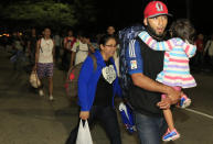 Migrantes parten a pie desde San Pedro Sula, Honduras, miércoles 15 de enero de 2020, con la esperanza de formar el tipo de caravana que llegó a la frontera de México con Estados Unidos en 2018 (AP Photo/Delmer Martinez)