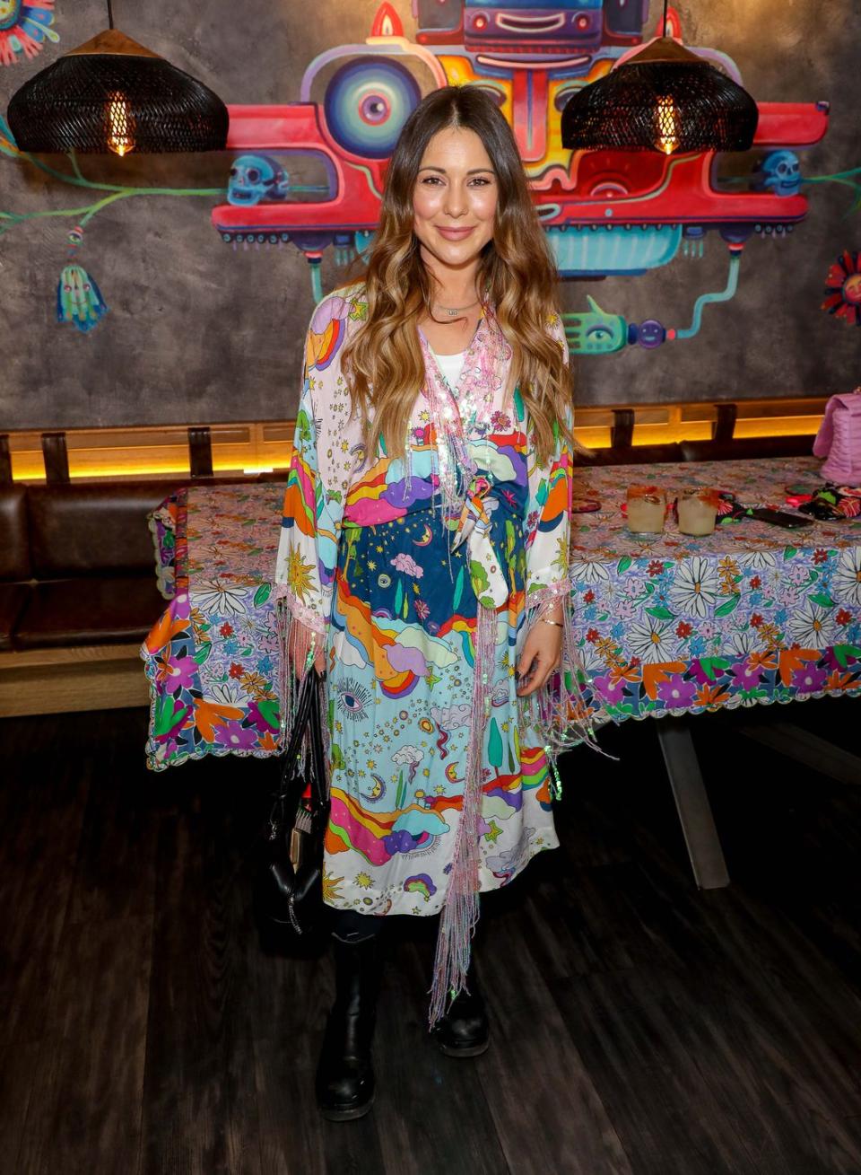 louise thompson wearing a colourful multiprint dress