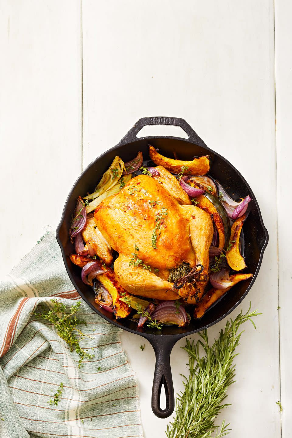 skillet roasted chicken with onions in a cast iron pan