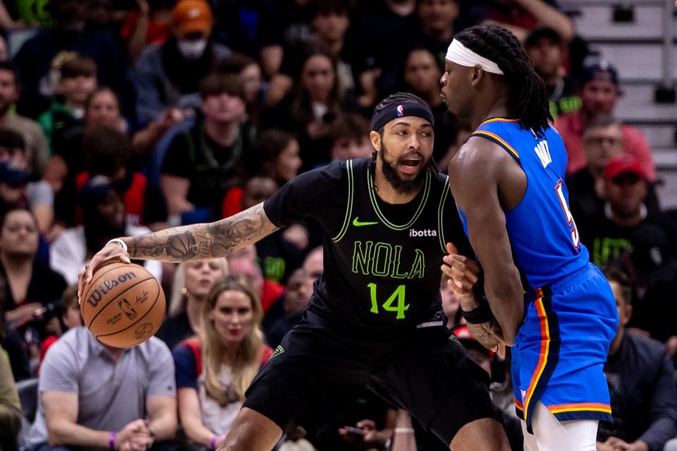 Apr 29, 2024; New Orleans, Louisiana, USA; New Orleans Pelicans forward Brandon Ingram (14) dribbles against Oklahoma City Thunder guard Luguentz Dort (5) during the second half of game four of the first round for the 2024 NBA playoffs at Smoothie King Center.